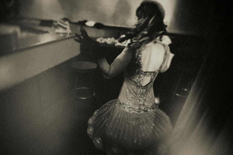 Cabarets are having a long tradition in Paris. Black and White photo with woman dancing in a bar in Paris