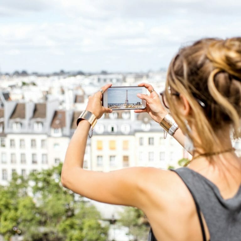Women taking picture of the Eiffel Tower