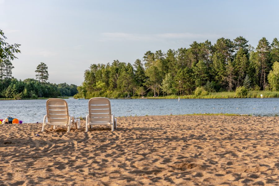 A beach that is close to Paris by a lake