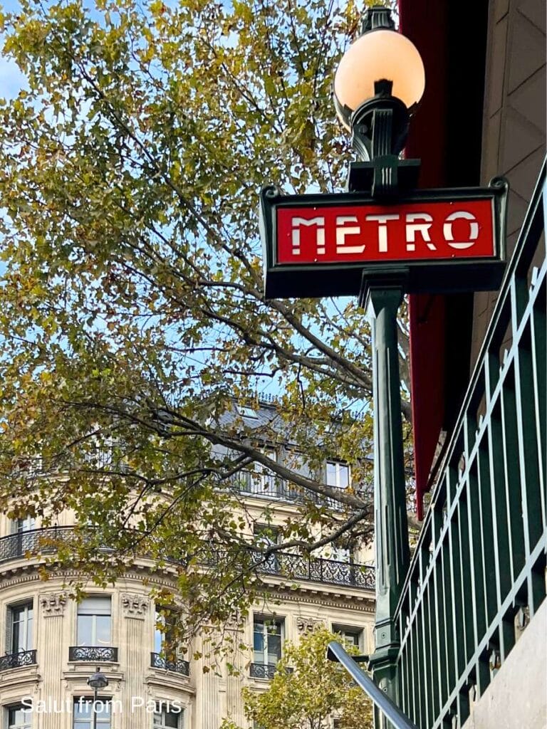 n a green post with a globe-shaped light at the top. The sign is framed by trees with autumn foliage and classic Parisian architecture in the background. The text 'Salut from Paris' appears in the bottom left corner.
