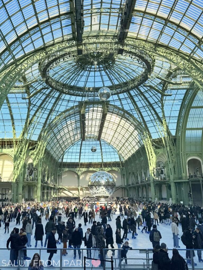 Ice Skating rink in the grand Palais in Paris. Art Nouveau Structure with massive Glass ceiling and green metal structure