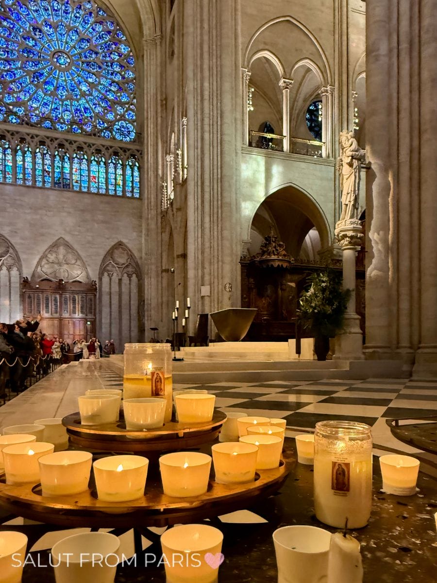 This image beautifully captures the serene interior of Notre Dame Cathedral after its 2024 reopening. The glowing candles in the foreground create a peaceful atmosphere, while the vibrant stained-glass rose window commands attention in the background. The delicate light filtering through the windows highlights the intricate Gothic architecture, bringing out the cathedral's timeless beauty. Visitors in the distance emphasize its grandeur and significance as one of Paris’s most iconic landmarks.