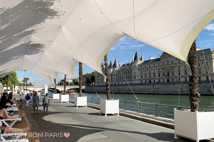 Covered lounging area along the Seine near the Conciergerie, part of Paris Plages' summer installation.