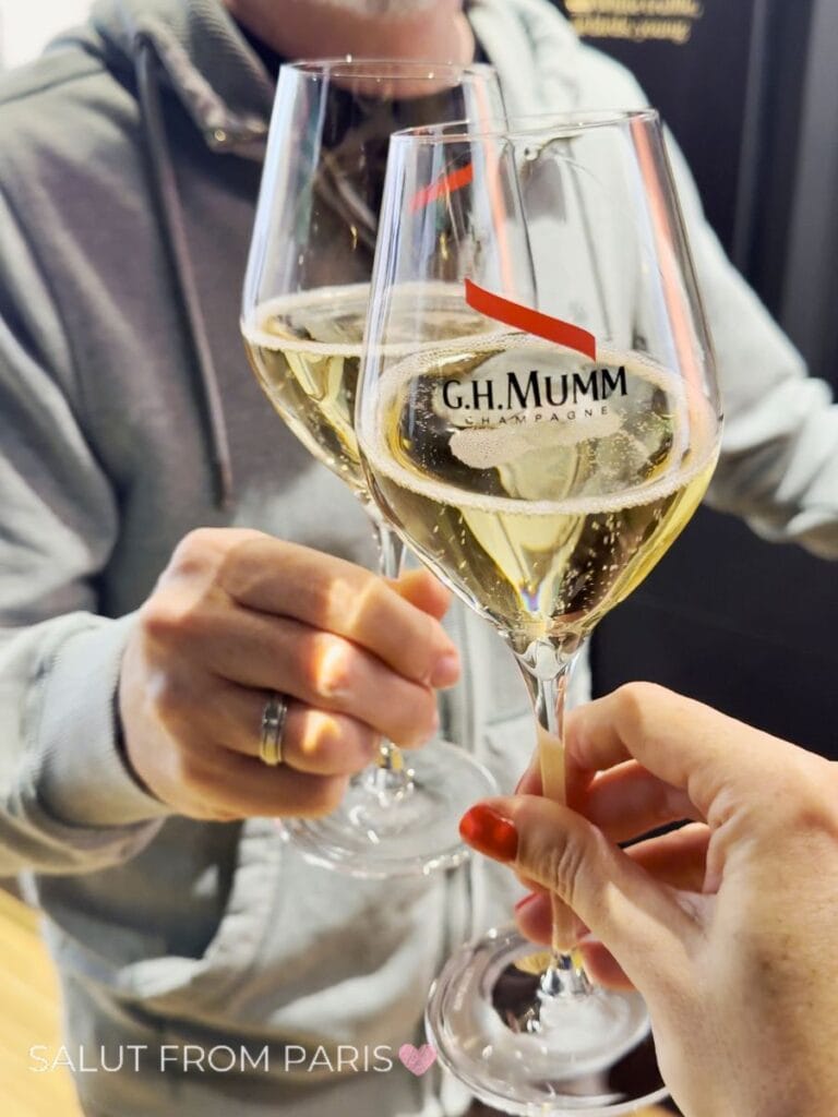 Champagne Day Trip from Paris - here to Mumm Champagne House. Two Glasses with Champagne and red label from G.H.Mumm